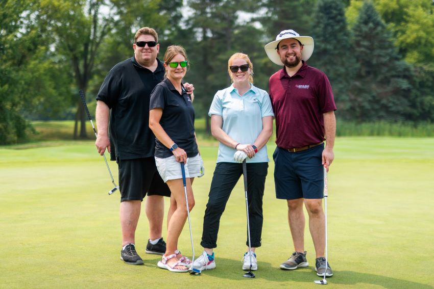 four golfers at the Cardinal Legacy Golf Outing